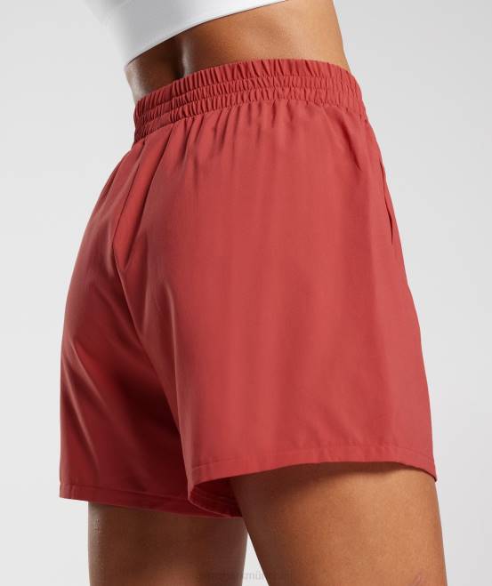sonnengetrocknetes Rot Kleidung Gymshark Frauen Shorts mit gewebten Taschen 04P856