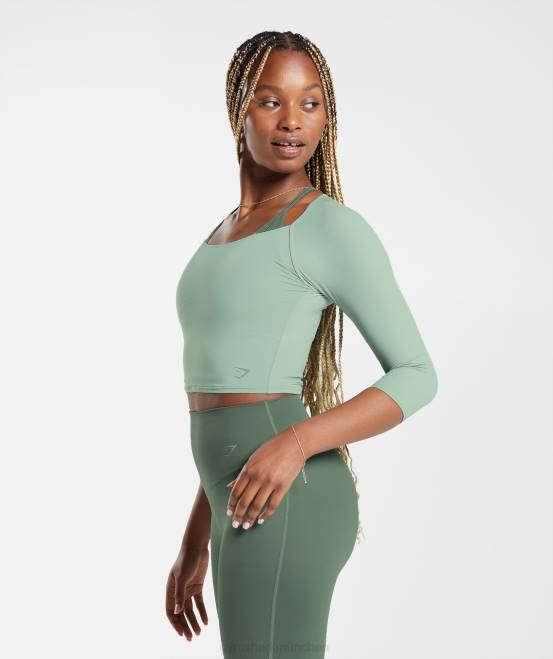 Wüstensalbeigrün Kleidung Gymshark Frauen Erhöhtes Crop-Top mit 3/4-Ärmeln 04P8448
